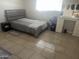 Bedroom with a bed and a window providing natural light and a dresser for storage at 5110 N 42Nd Dr, Phoenix, AZ 85019
