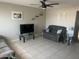 Spacious living room features a ceiling fan, neutral paint, and tile flooring at 5110 N 42Nd Dr, Phoenix, AZ 85019