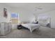 Bright bedroom with a ceiling fan, desk area, and plenty of natural light at 5211 W Wikieup Ln, Glendale, AZ 85308