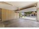 Spacious garage with ample storage cabinets and an open view of the neighborhood at 5211 W Wikieup Ln, Glendale, AZ 85308