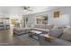 Bright living room with a comfortable sectional sofa and view of the backyard at 5211 W Wikieup Ln, Glendale, AZ 85308
