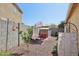 Backyard featuring an outdoor table, and shed, perfect for enjoying the outdoors at 5724 N 108Th Ave, Phoenix, AZ 85037