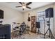 Bedroom with drumset, guitar and display case, complemented by a ceiling fan for optimal comfort at 5724 N 108Th Ave, Phoenix, AZ 85037