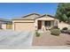 Charming single-story home with a two-car garage, low-maintenance landscaping, and inviting front porch at 5724 N 108Th Ave, Phoenix, AZ 85037