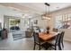 Open living space with access to backyard and views into the dining area at 5724 N 108Th Ave, Phoenix, AZ 85037