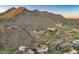 Stunning aerial view showcases desert homes nestled in the mountainside with winding roads at 6432 E El Sendero Rd, Carefree, AZ 85377