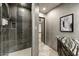 Modern bathroom with a glass-enclosed shower, tile accents, and a vanity with a marble countertop at 6432 E El Sendero Rd, Carefree, AZ 85377