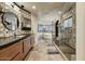 Modern bathroom design featuring glass enclosed shower, soaking tub and dual sinks at 6432 E El Sendero Rd, Carefree, AZ 85377