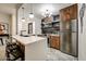 Modern kitchen features stainless steel appliances, island with seating, and stylish backsplash at 6432 E El Sendero Rd, Carefree, AZ 85377