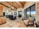 Bright kitchen showcasing wood-beamed ceilings, two islands, stainless steel appliances, and a lovely seating area at 6432 E El Sendero Rd, Carefree, AZ 85377