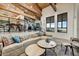 Living room with wooden ceilings, modern lighting and a stairway with metal railing at 6432 E El Sendero Rd, Carefree, AZ 85377
