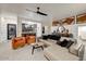 Inviting living room featuring modern furnishings, artwork, and a glimpse of the kitchen at 6432 E El Sendero Rd, Carefree, AZ 85377