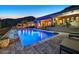 Inviting outdoor pool with stone patio and mountain views for relaxing and entertaining at 6432 E El Sendero Rd, Carefree, AZ 85377