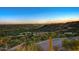 Picturesque view overlooking lush desert landscape with mountains in the distance at sunset at 6432 E El Sendero Rd, Carefree, AZ 85377