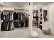 Spacious walk-in closet with ample storage and custom shelving at 6432 E El Sendero Rd, Carefree, AZ 85377