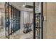 A modern wine cellar with glass enclosure and metal racking offers ample storage at 6432 E El Sendero Rd, Carefree, AZ 85377