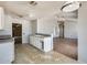 Bright kitchen with open floor plan and view into the living room at 6804 W Turquoise Ave, Peoria, AZ 85345