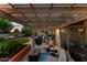 Relaxing back patio has pergola covering comfortable seating and a beautiful outdoor entertaining space at 6907 W Monona Dr, Glendale, AZ 85308
