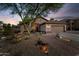 Charming home with desert landscaping, brick walkway, and a two-car garage at 6907 W Monona Dr, Glendale, AZ 85308