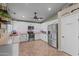 Spacious kitchen with stainless steel appliances and white cabinetry at 6907 W Monona Dr, Glendale, AZ 85308