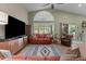 Comfortable living room with access to the kitchen and sliding doors to the outdoors at 6907 W Monona Dr, Glendale, AZ 85308