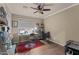 Comfortable home office features neutral paint, a large window, ceiling fan, and a charming Boston Red Sox rug at 6907 W Monona Dr, Glendale, AZ 85308