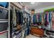 Organized walk-in closet with ample storage, shelves, and hanging space at 6907 W Monona Dr, Glendale, AZ 85308