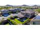 An aerial view of the property showcasing the backyard, covered patio, hot tub, and desert landscaping at 7123 W Andrea Dr, Peoria, AZ 85383