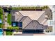 Aerial view of the home showcasing the backyard, covered patio, hot tub, and artificial turf area at 7123 W Andrea Dr, Peoria, AZ 85383