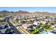 Lush community featuring two-story homes, desert landscaping, paved streets, and mountain views at 7123 W Andrea Dr, Peoria, AZ 85383