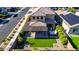 Aerial view of a home featuring a covered patio, hot tub, and well-maintained artificial grass in the backyard at 7123 W Andrea Dr, Peoria, AZ 85383