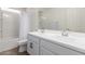 Bathroom featuring a double sink vanity and shower/tub combo with curtain at 7123 W Andrea Dr, Peoria, AZ 85383
