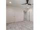 Bedroom with neutral carpeting and ceiling fan plus open door to hall at 7123 W Andrea Dr, Peoria, AZ 85383