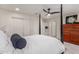 Bedroom featuring a four-poster bed and view into the upstairs living area at 7123 W Andrea Dr, Peoria, AZ 85383
