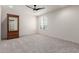 Spacious bedroom with natural light and neutral carpeting at 7123 W Andrea Dr, Peoria, AZ 85383