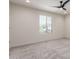 Bright bedroom with natural light, ceiling fan, and neutral carpeting at 7123 W Andrea Dr, Peoria, AZ 85383