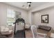 Bright exercise room with a treadmill, two chairs, a mirror, and a bench at 7123 W Andrea Dr, Peoria, AZ 85383