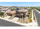 Two-story home featuring an attached two-car garage, stone accents, desert landscaping and mountain views at 7123 W Andrea Dr, Peoria, AZ 85383