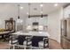 Bright kitchen with a large island, stainless steel appliances, and a dining area at 7123 W Andrea Dr, Peoria, AZ 85383