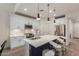 Bright kitchen with an island, stainless steel appliances, and pendant lighting at 7123 W Andrea Dr, Peoria, AZ 85383
