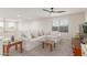Cozy loft area with a comfortable white sofa, bright windows, and a ceiling fan at 7123 W Andrea Dr, Peoria, AZ 85383