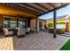 Beautiful covered patio features a fire pit, hot tub, and comfortable seating, perfect for entertaining outdoors at 7123 W Andrea Dr, Peoria, AZ 85383