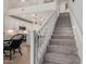 Elegant staircase with carpeted steps leading to the upper level, with a view of the kitchen at 7123 W Andrea Dr, Peoria, AZ 85383
