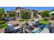 Picturesque backyard with a putting green, brick patio, and cozy seating, ideal for relaxation at 7128 E Bramble Berry Ln, Scottsdale, AZ 85266