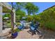 Inviting backyard with a fire pit and seating area perfect for enjoying the Arizona outdoors at 7128 E Bramble Berry Ln, Scottsdale, AZ 85266