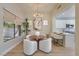 An eat-in dining nook next to the kitchen features lots of light and modern decor at 7128 E Bramble Berry Ln, Scottsdale, AZ 85266