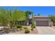 Charming single-story home with a desert landscaped front yard and attached two car garage at 7128 E Bramble Berry Ln, Scottsdale, AZ 85266