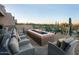 A comfortable outdoor seating area with a firepit, perfect for enjoying the desert views at 7128 E Bramble Berry Ln, Scottsdale, AZ 85266