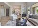 Bright open floor plan living room that flows into the entry and dining area at 7128 E Bramble Berry Ln, Scottsdale, AZ 85266