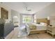 Inviting main bedroom with neutral tones, ceiling fan, and backyard views at 7128 E Bramble Berry Ln, Scottsdale, AZ 85266